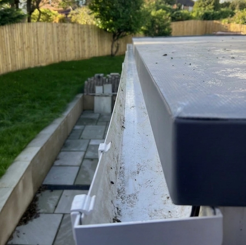 Clear gutters after professional Puralux service.